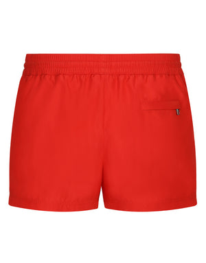 SHORT SWIM TRUNKS WITH BRANDED PLATE