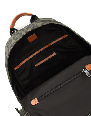 NYLON BACKPACK WITH LEOPARD PRINT AGAINST A GREEN BACKGROUND AND BRANDED PLATE