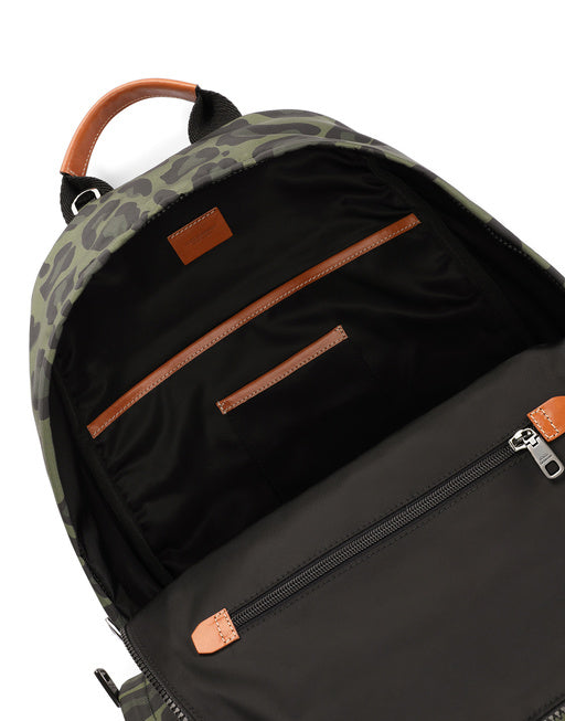 NYLON BACKPACK WITH LEOPARD PRINT AGAINST A GREEN BACKGROUND AND BRANDED PLATE