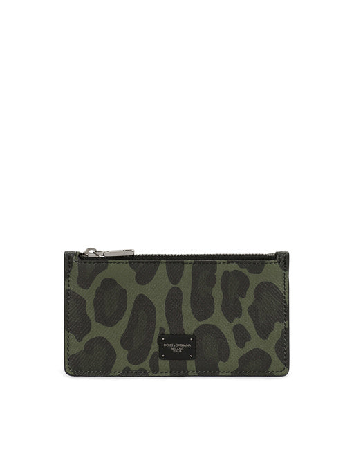 DAUPHINE CALFSKIN CARD HOLDER WITH LEOPARD PRINT AGAINST A GRAY BACKGROUND