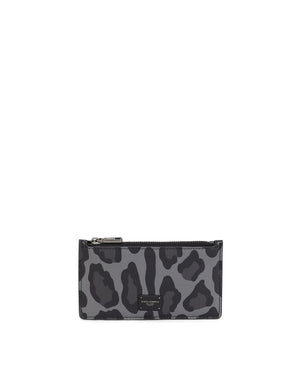 DAUPHINE CALFSKIN CARD HOLDER WITH LEOPARD PRINT AGAINST A GRAY BACKGROUND