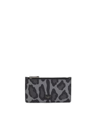 DAUPHINE CALFSKIN CARD HOLDER WITH LEOPARD PRINT AGAINST A GRAY BACKGROUND
