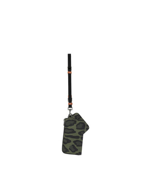 NYLON MULTI-PURPOSE KIT WITH LEOPARD PRINT AGAINST A GREEN BACKGROUND AND BRANDED PLATE