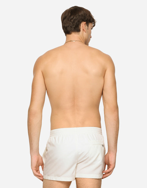 SHORT SWIM TRUNKS WITH BRANDED TAG