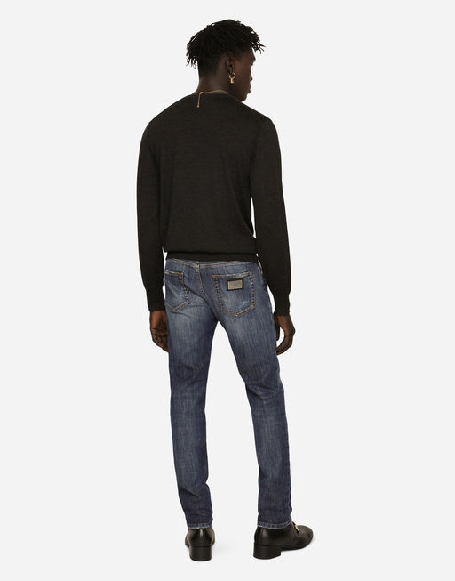 SLIM FIT WASHED STRETCH JEANS WITH SUBTLE ABRASIONS